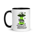 Mug with alien and cow graphic and 'Quality Control' text on a white background